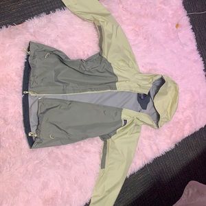 Yellow Patagonia windbreaker raincoat.